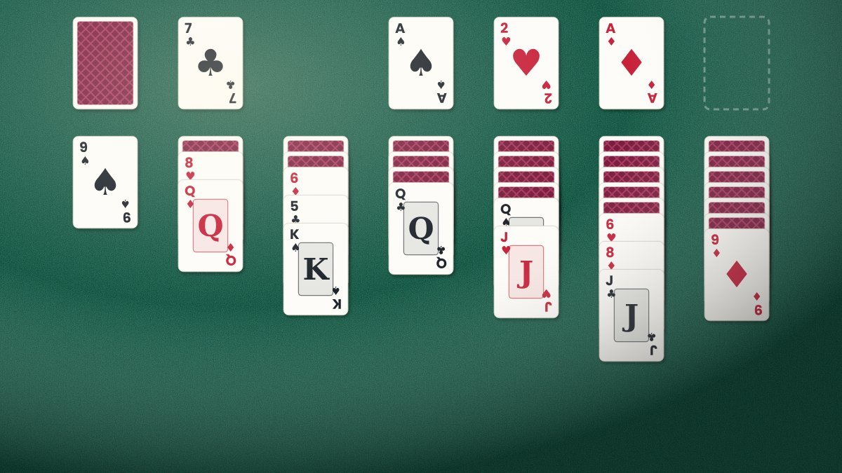 Classic Klondike solitaire layout with seven columns of playing cards on a green felt table